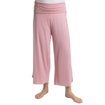 Pink pants worn by a person on a white background showcasing low-rise waistband