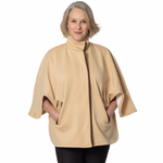Woman wearing a beige cape on a white background 