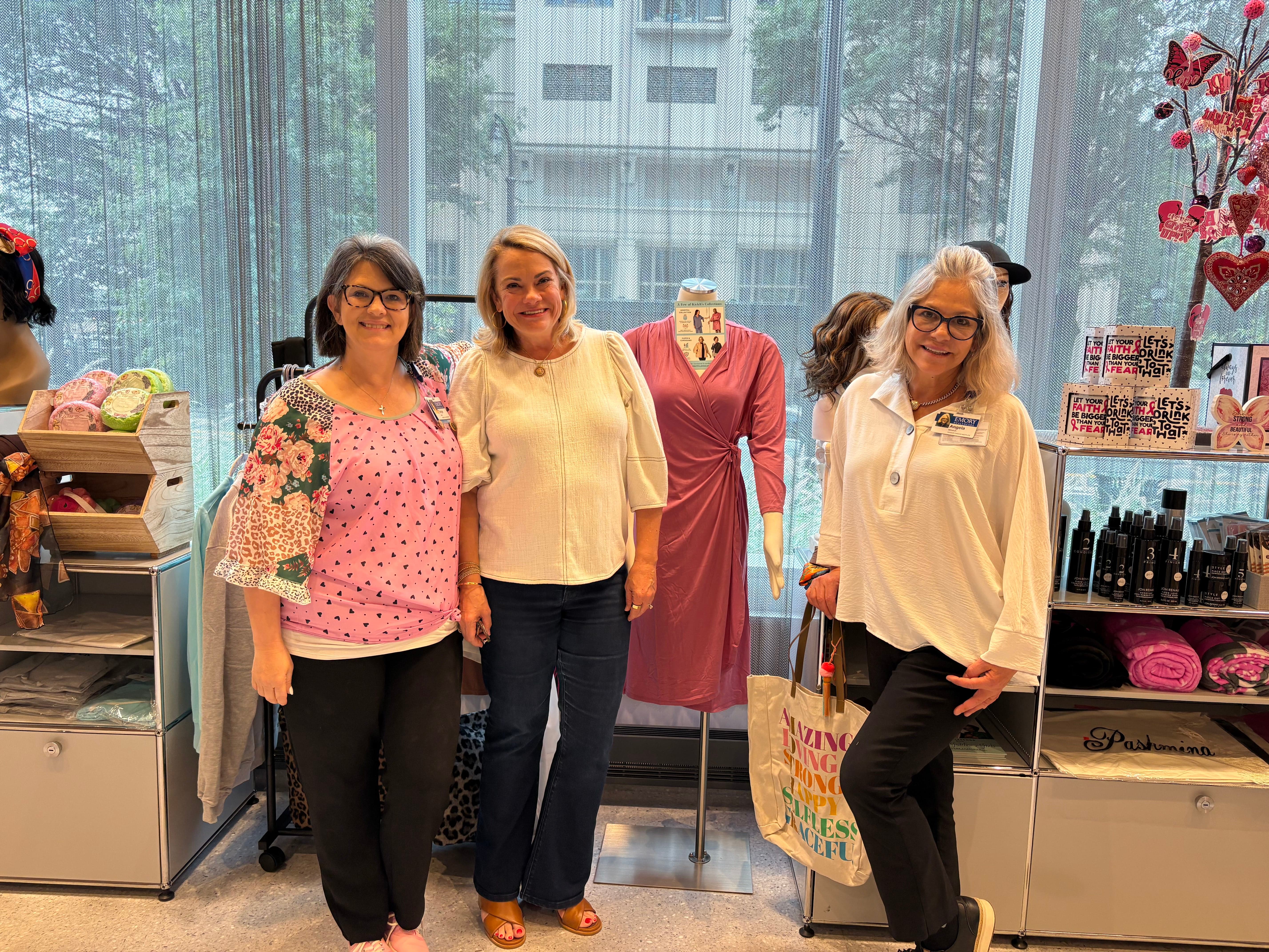 Owner Beth with two women from Emory's Radiance shop