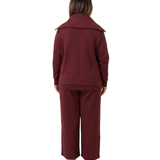 Woman in mulberry red recovery set backside shot