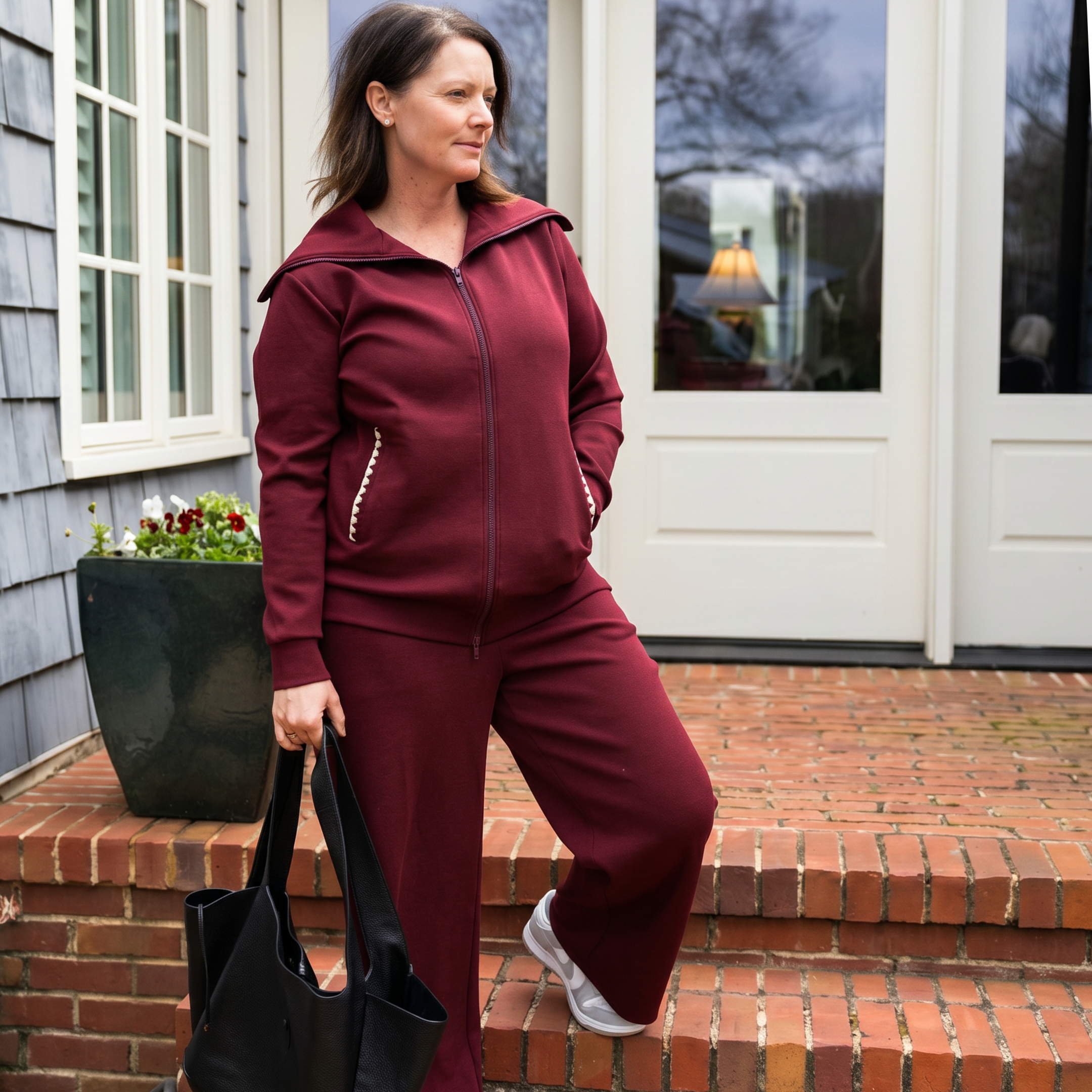 woman in red recovery set as she leaves her house with her drain pockets secured