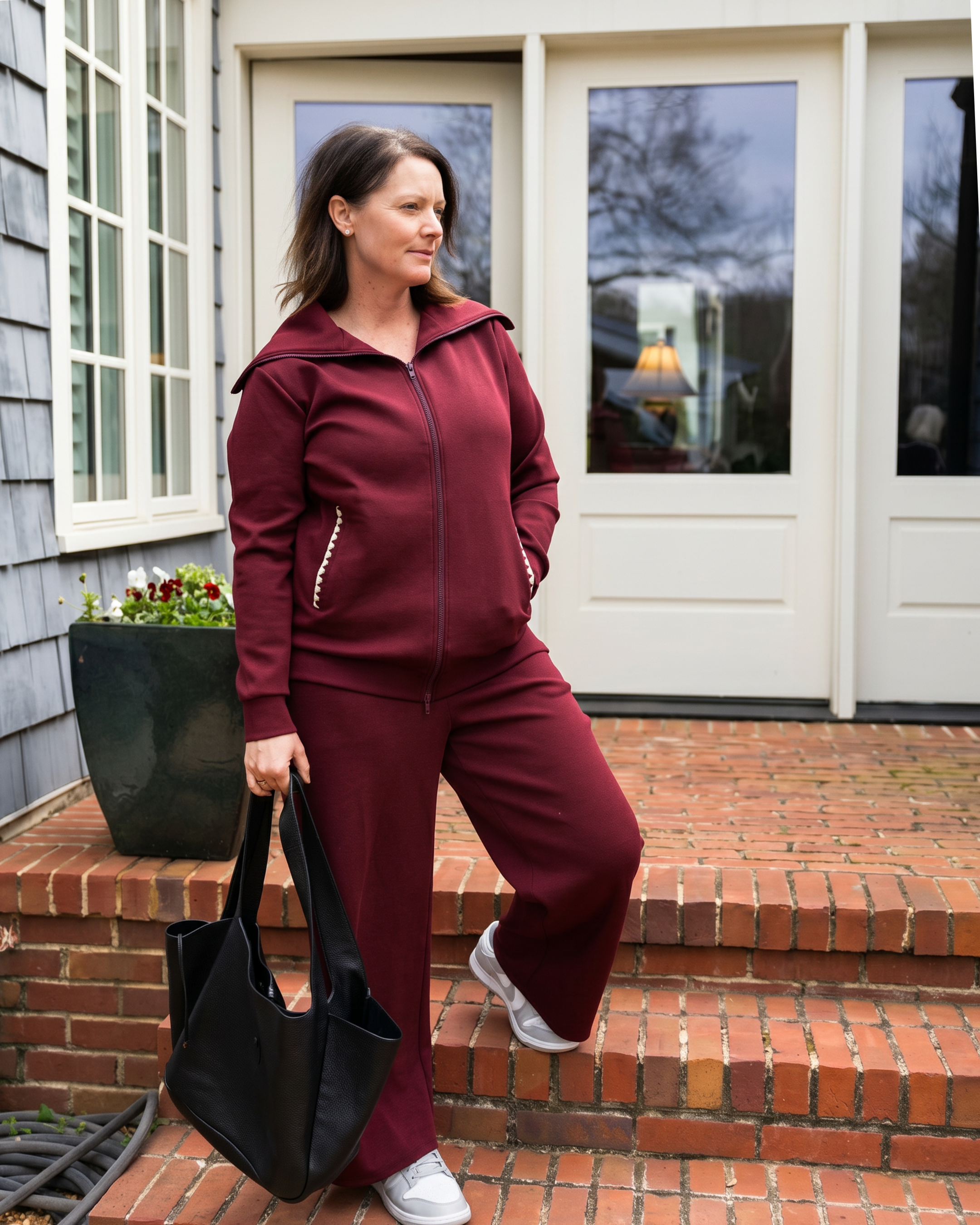 woman in red recovery set as she leaves her house with her drain pockets secured