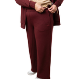 Woman in mulberry red recovery set pants showcasing the side closure