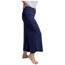 Navy blue pants worn by a person on a white background