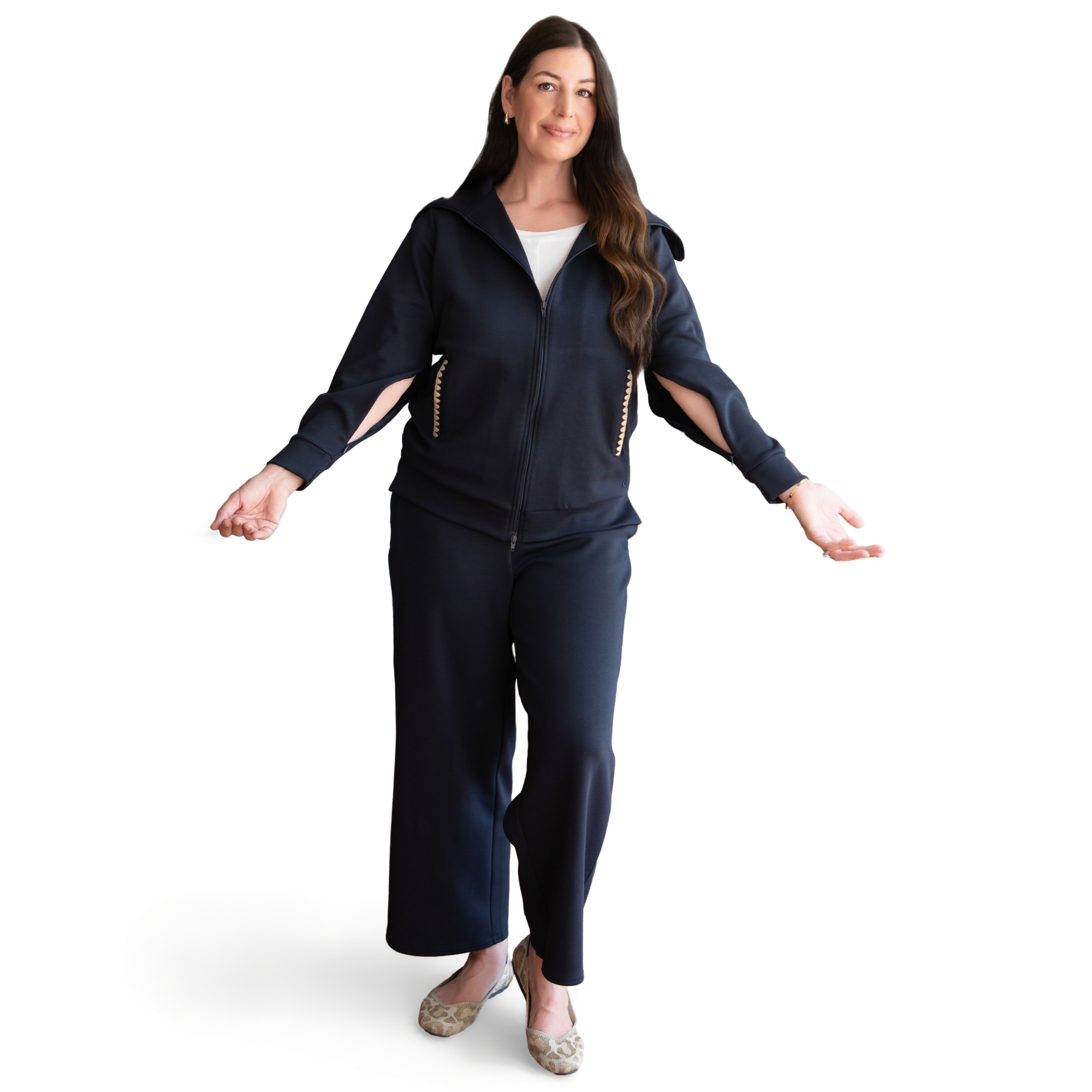 Woman wearing a navy blue adaptive loungewear set that features arm zippers for medical access on a white background