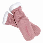 Pink cable knit socks with white fleece interior cuffed at the top and non-slip grip bottoms against a white background