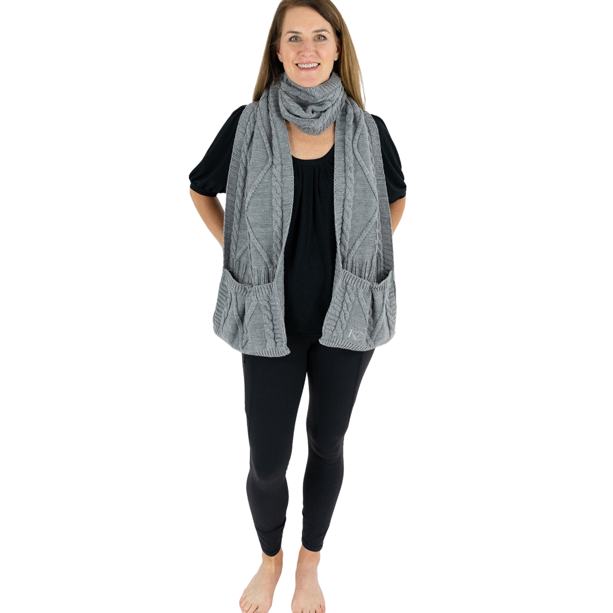 Woman wearing a gray scarf with deep pockets on a white background