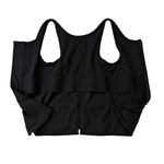 Black post surgery tank top with a front zipper on a white background, fabric close up that highlights adaptive functionality