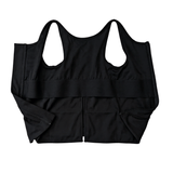 Black post surgery tank top with a front zipper on a white background, fabric close up that highlights adaptive functionality