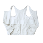 white post surgery tank top with a front zipper on a white background, fabric close up that highlights adaptive functionality