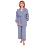 A woman modeling a two-piece post surgery pajamas set consisting of a long-sleeve belted robe and matching pants, featuring vertical stripes in navy blue, against a plain white background.
