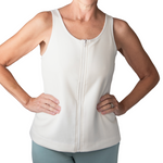 Person wearing a white tank top with zipper front opening on a white background
